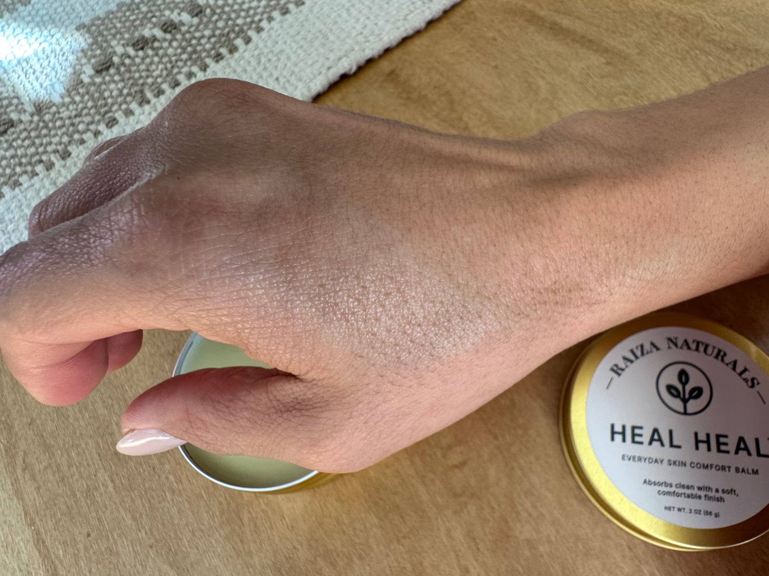 Heal Heal everyday skin comfort balm applied to dry skin, showing clean absorption and a soft, natural finish