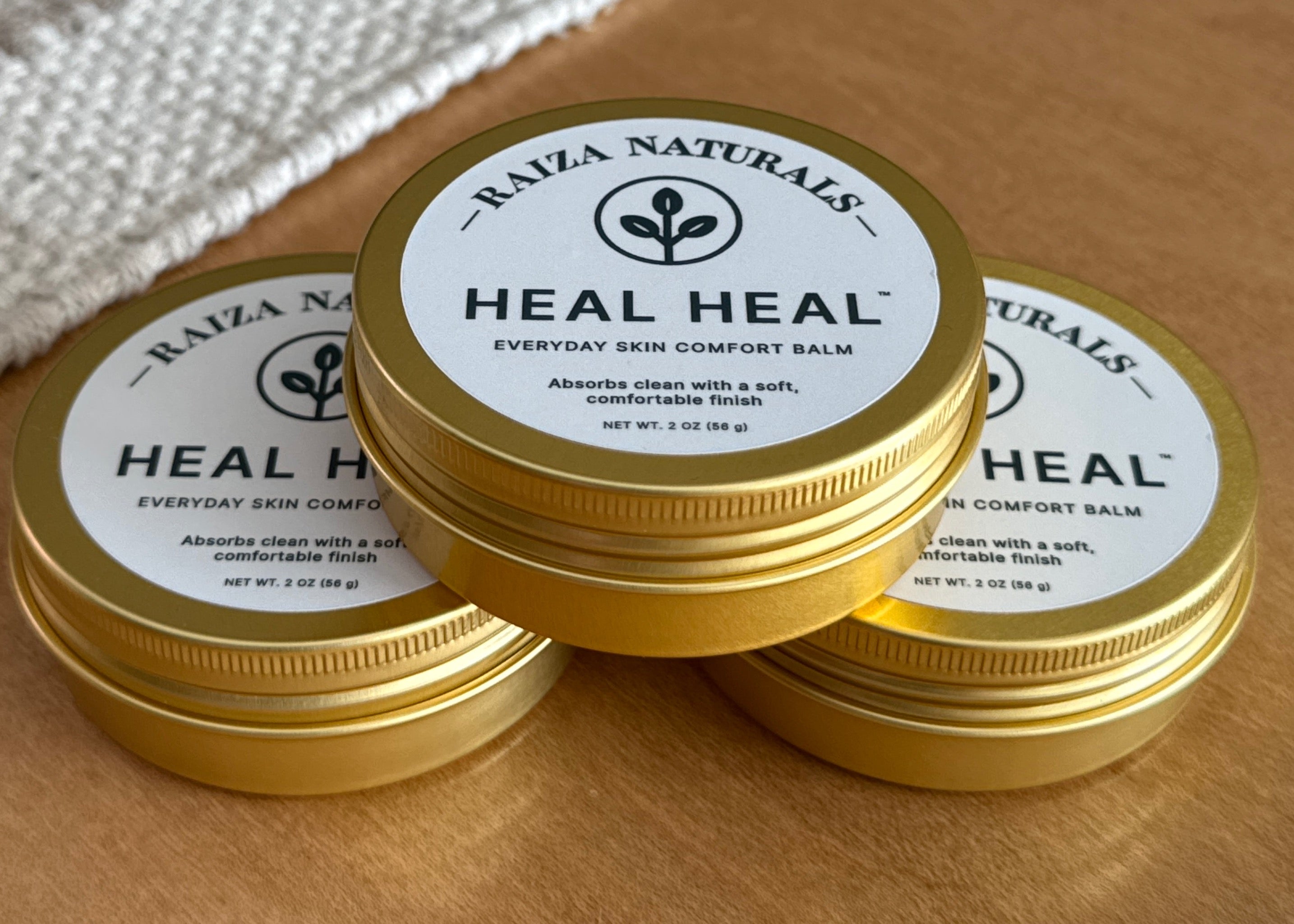 Three Heal Heal everyday skin comfort balm tins, ideal for keeping one at home, one in your bag, and one on the go
