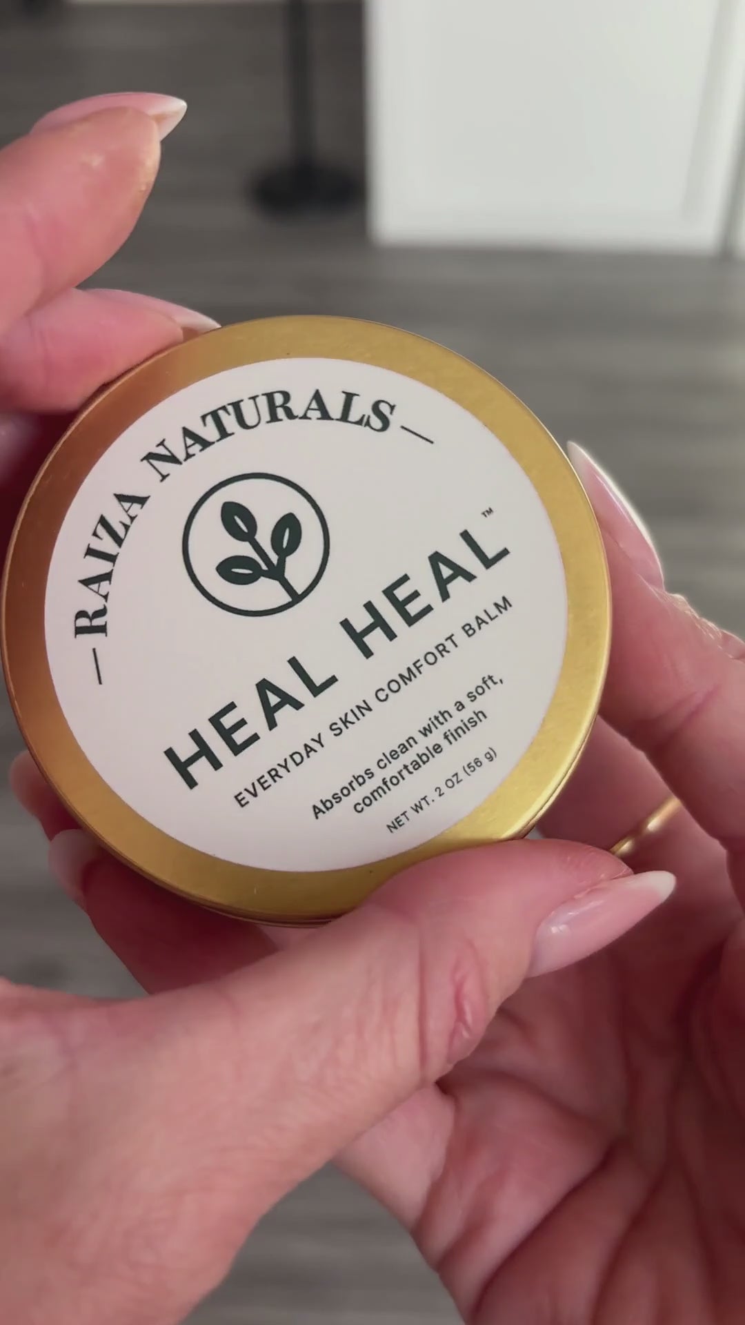 Load video: Close-up of hands after applying Heal Heal, showing the balm absorbing cleanly with a soft, natural finish.